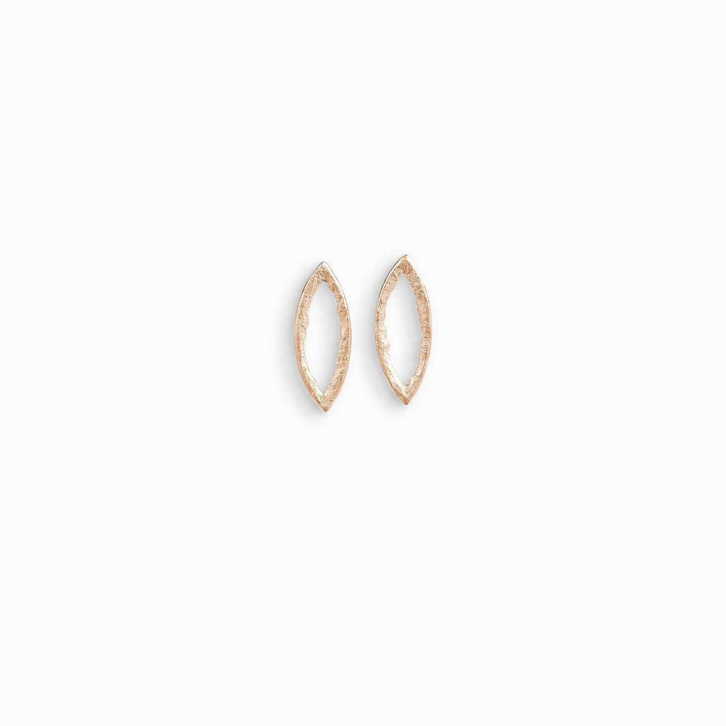 A pair of 18ct Fairtrade rose gold stud earrings, lozenge in form with an open centre. Strong organic texture. Smooth outside edge, fragmented inside edges. 26mm x 10mm 