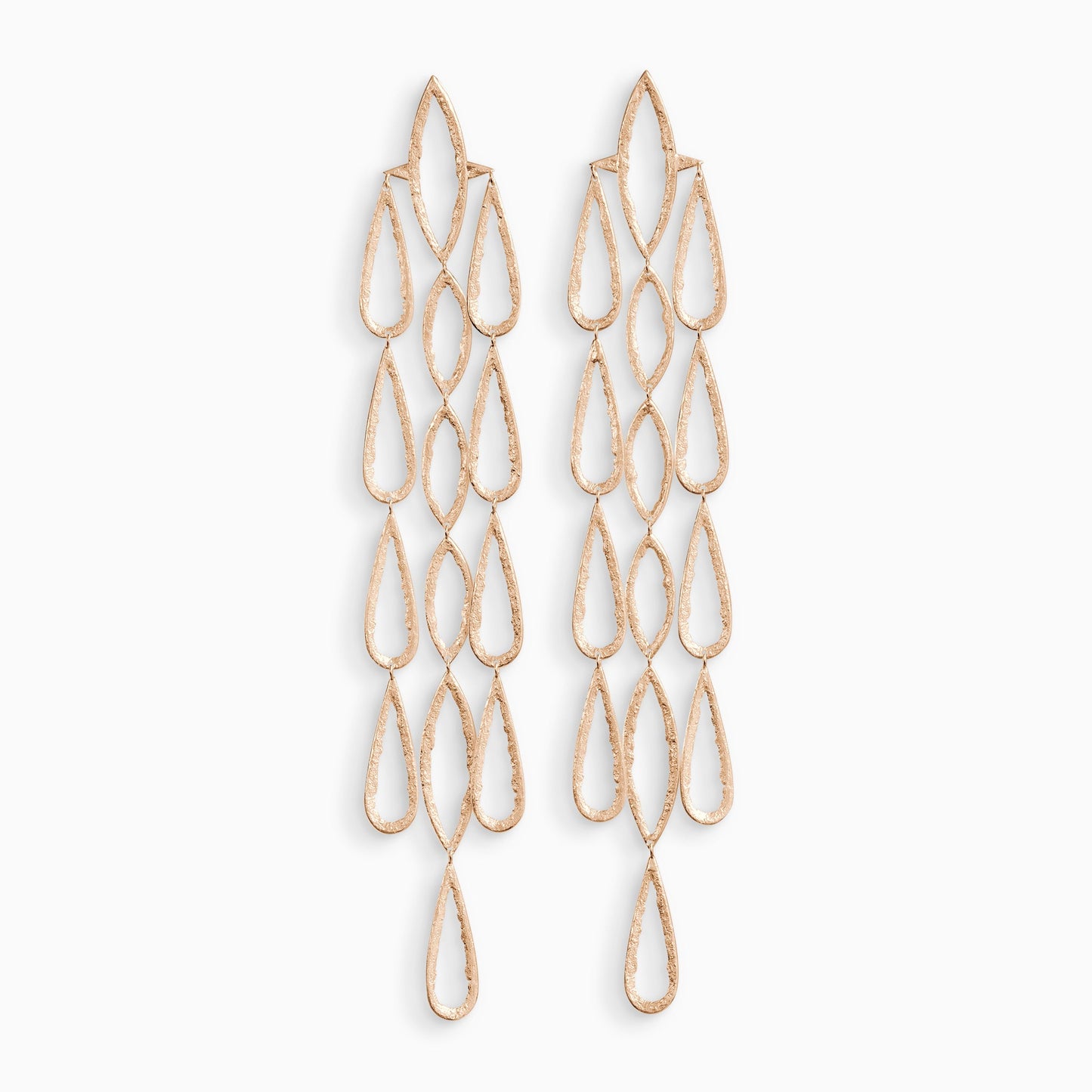 A pair of 18ct Fairtrade rose  gold drop earrings. 3 parallel lines of articulating large teardrop shapes hang from a large lozenge shapes with a stud ear fastening . These open shapes have a strong organic texture and are smooth on the outside edges with fragmented inside edges. 192mm length. 32mm width.