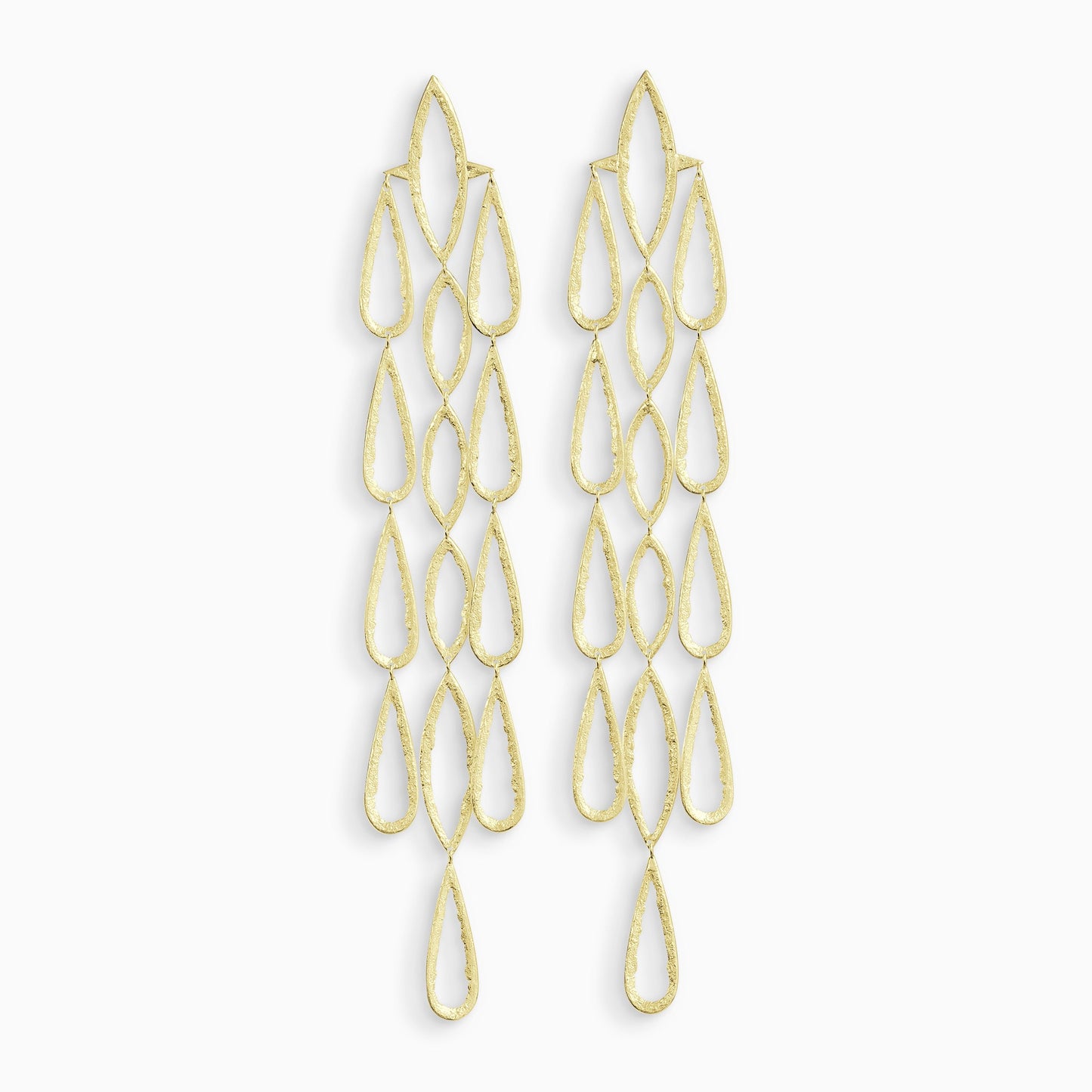 A pair of 18ct Fairtrade yellow gold drop earrings. 3 parallel lines of articulating large teardrop shapes hang from a large lozenge shapes with a stud ear fastening . These open shapes have a strong organic texture and are smooth on the outside edges with fragmented inside edges. 192mm length. 32mm width.