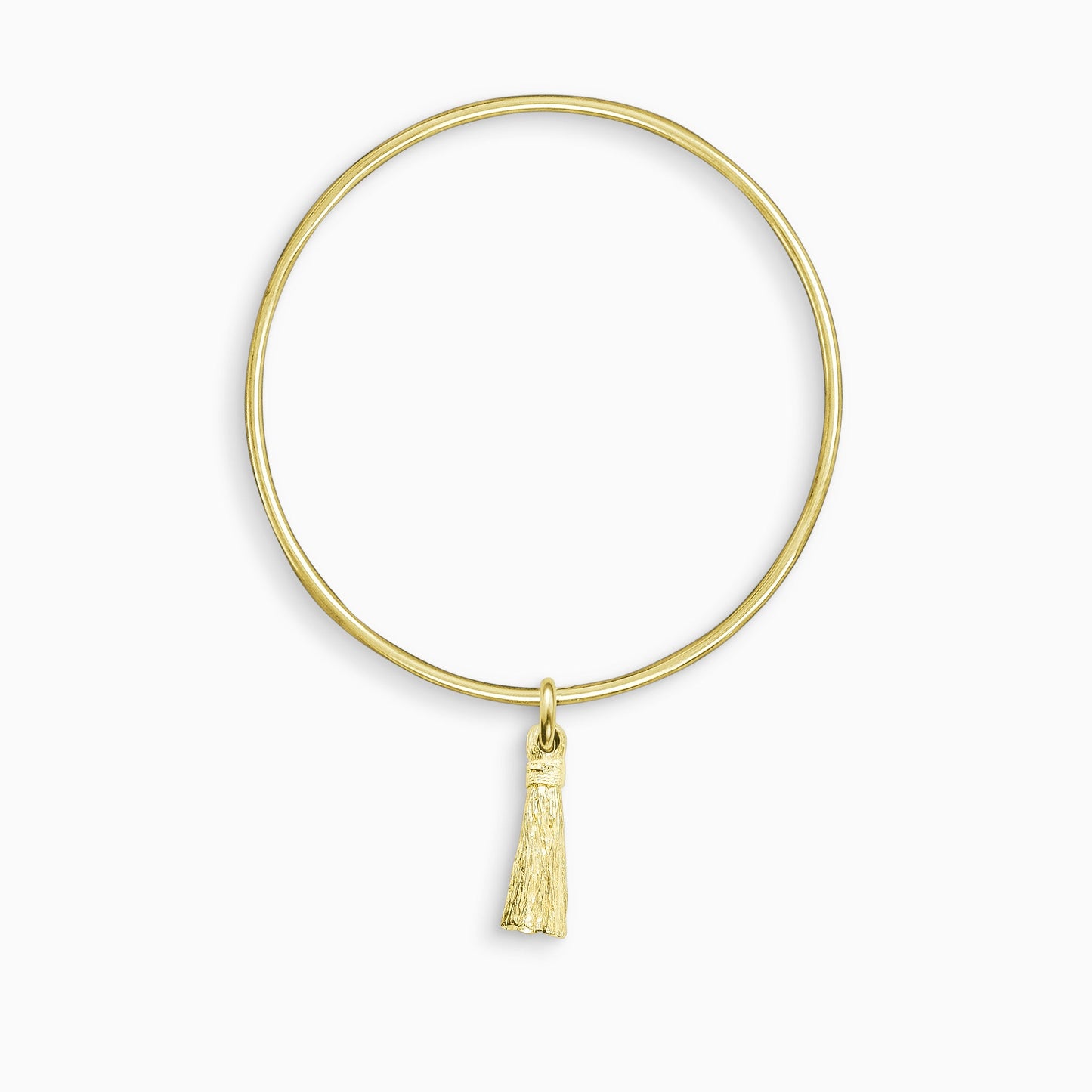 An 18ct Fairtrade yellow goldTassel charm, with the texture of an actual tassel, freely moving on a round wire bangle. Charm 25mm. Bangle 63mm inside diameter x 2mm round wire.