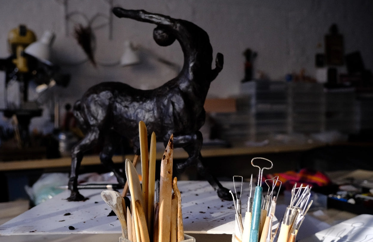 Carving a centaur in wax prior to casting in bronze.