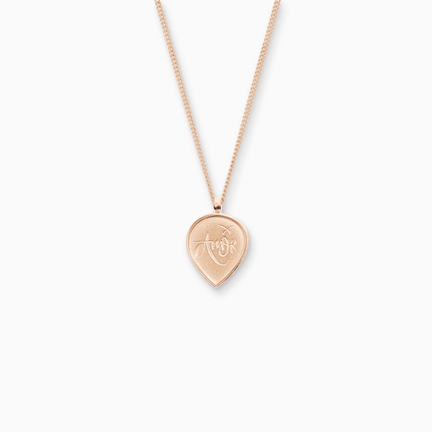18ct Fairtrade rose gold teardrop shaped pendant, 25cm x 16mm on a 45cm fine curb chain. Amor, the Latin for Love is inscribed in a handwritten script on the front of the pendant.