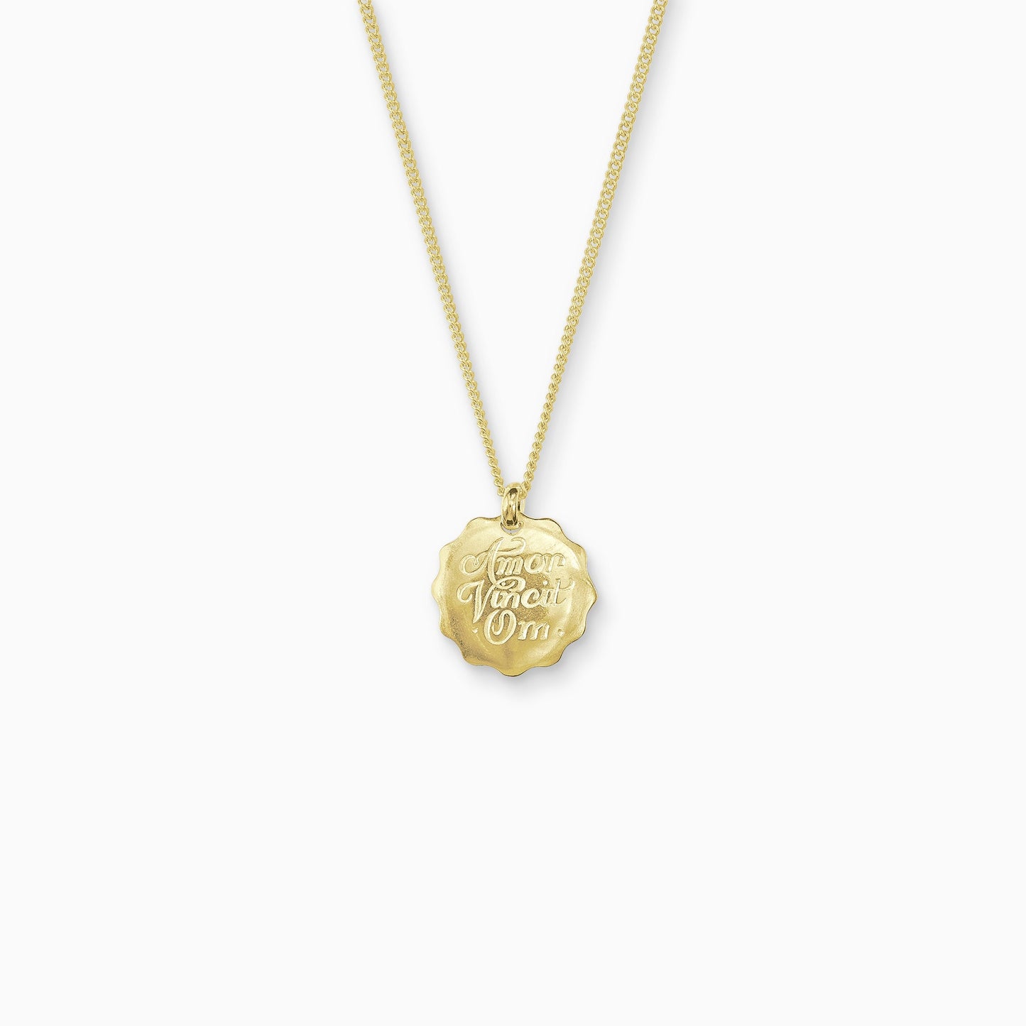18ct Fairtrade yellow gold round 22mm diameter charm on a 45cm fine curb chain. The pendant is smooth with a wavy outside edge. Amor Vincit Om, the Medieval Latin for Love Conquers All  is inscribed on the front in a Copperplate script. 