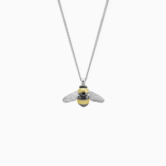 Recycled Silver pendant in the exact form of a Bumble Bee. 22mm x 28mm on a 45cm fine curb chain. The smooth, shiny body of the Bee is decorated with stripes of gold vermeil and black rhodium and the wings are textured with veins. 