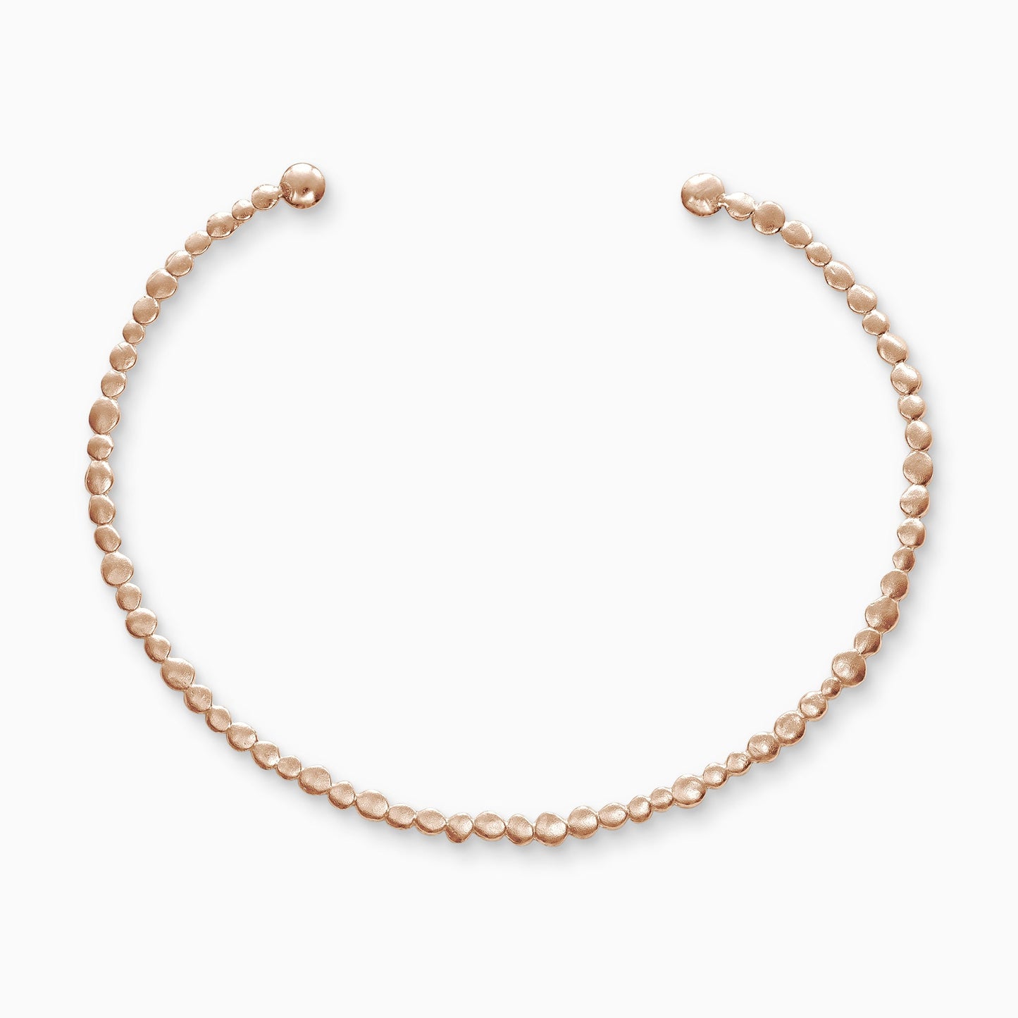18ct Fairtrade rose gold collar. A line of dainty textured dots of gold in varying sizes form a collar worn close to the neck. Open ended to enable taking on and off. 125mm x 100mm