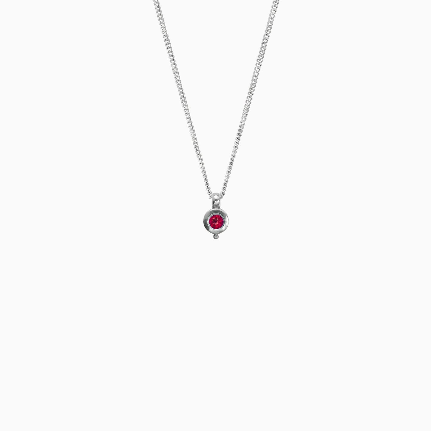Recycled platinum round pendant 12mm  x 7mm with small round bead attached below on a 45cm fine curb chain. Set with a 4mm round ruby.