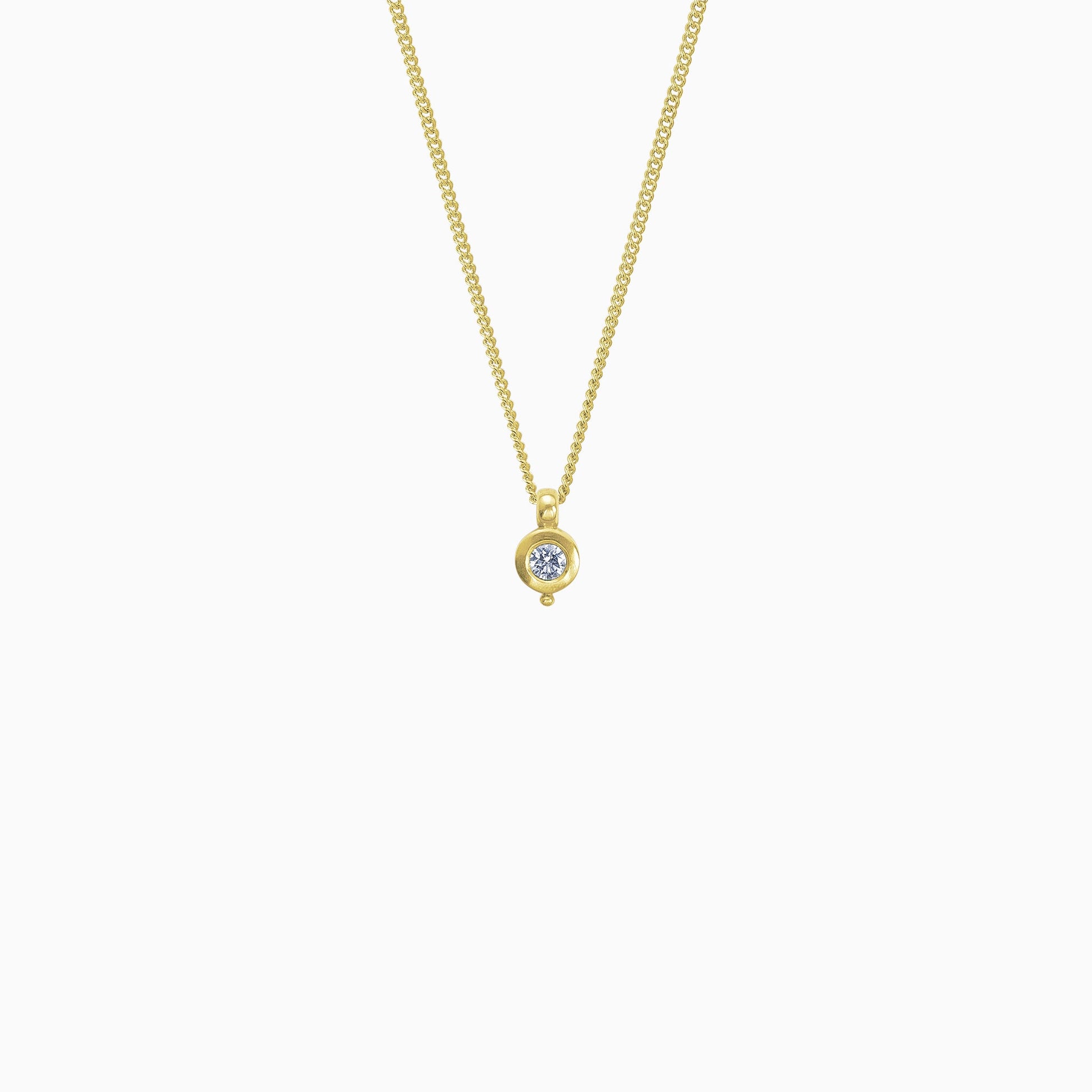18ct Fairtrade yellow gold round pendant 12mm  x 7mm with small round bead attached below on a 45cm fine curb chain. Set with a 0.25ct round diamond.