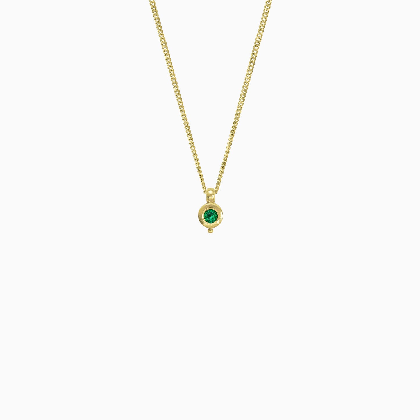 18ct Fairtrade yellow gold round pendant 12mm  x 7mm with small round bead attached below on a 45cm fine curb chain. Set with a 4mm round emerald.