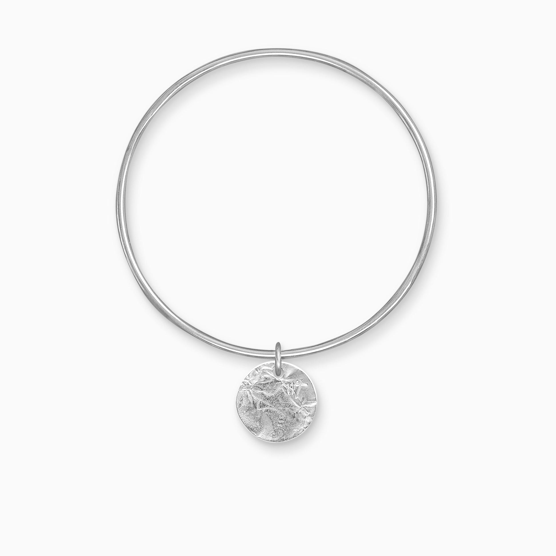 A recycled Silver textured, circular, flat disc charm freely moving on a round wire bangle. Charm 17mm. Bangle 63mm inside diameter x 2mm round wire.