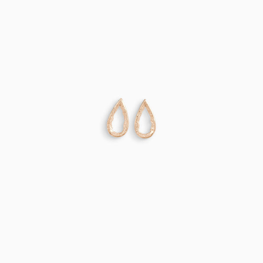 A pair of 18ct Fairtrade rose gold stud earrings, teardrop in form with an open centre. Strong organic texture. Smooth outside edge, fragmented inside edges. 19mm x 10mm 