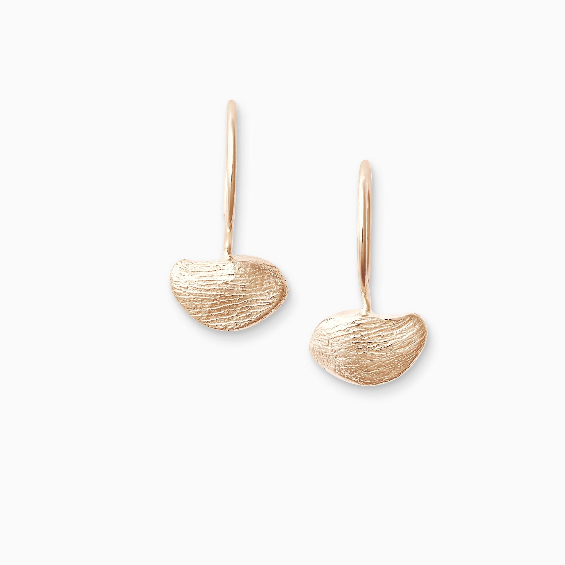 A pair of 18ct Fairtrade rose gold drop hoop earrings with a hoop fastening. Strong texture and irregular form. 22mm x 12mm plus round hoop ear wire