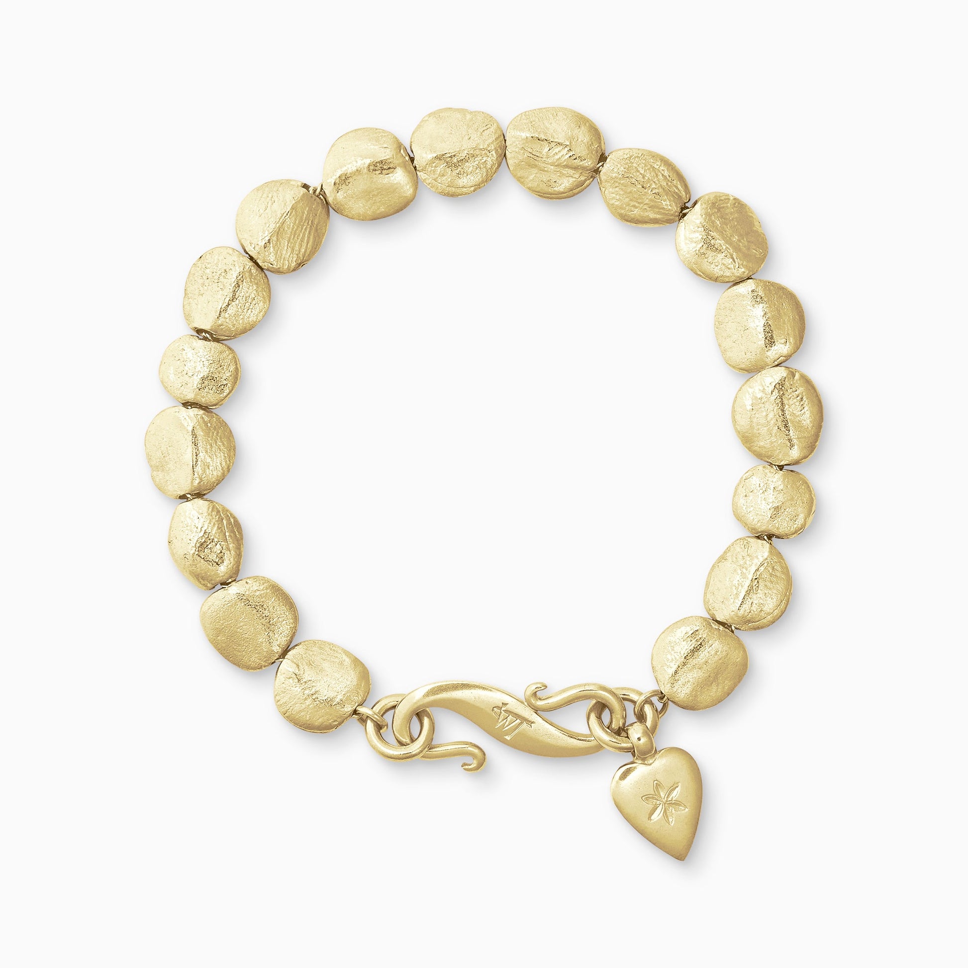 An 18ct Fairtrade yellow gold bracelet of handmade textured beads with a smooth heart shaped charm engraved with a 6 petal flower and our signature ’S’ clasp. Bracelet length 210mm. Beads varying from approximately 7mm x 4mm to 10mm x 11mm