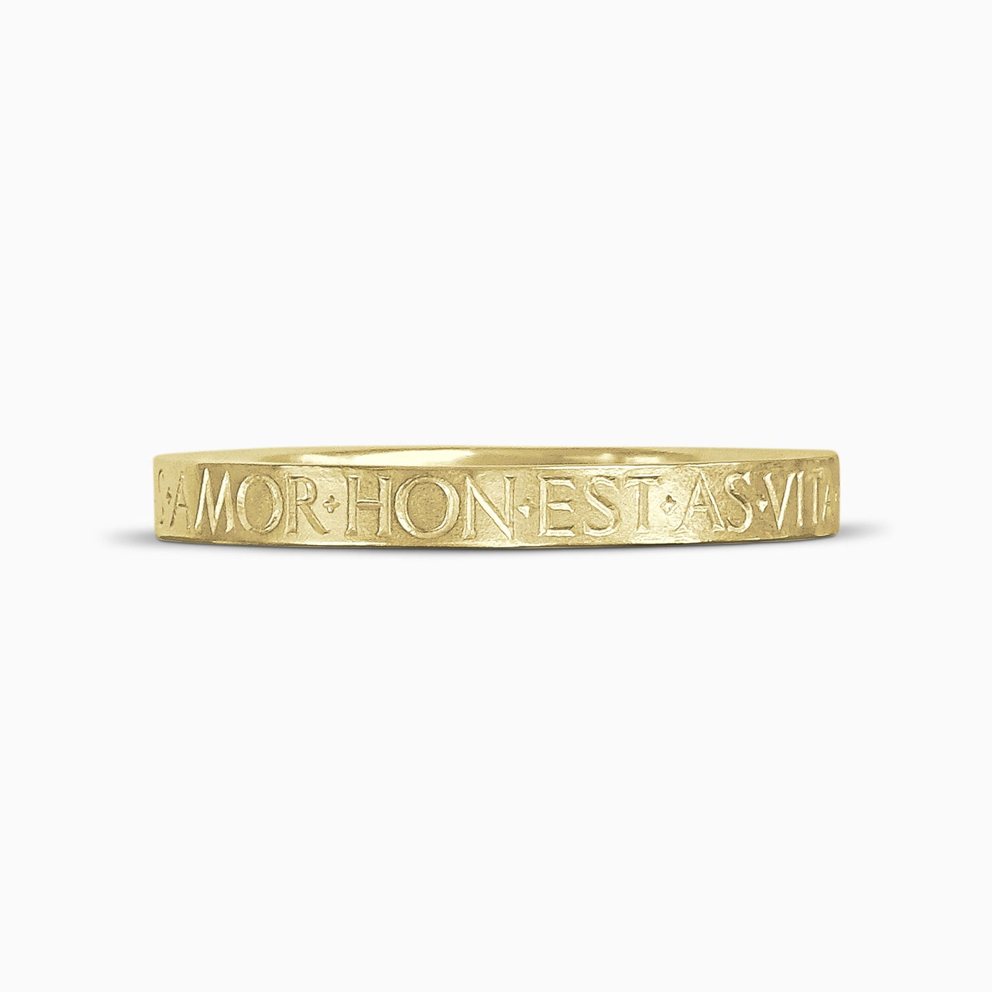An 18ct Fairtrade yellow gold bangle with Love, Honour, Courage, Hope, Peace,Truth and Life deeply engraved in Roman capitals around the outside. Width 8mm. Inside diameter 64mm. 