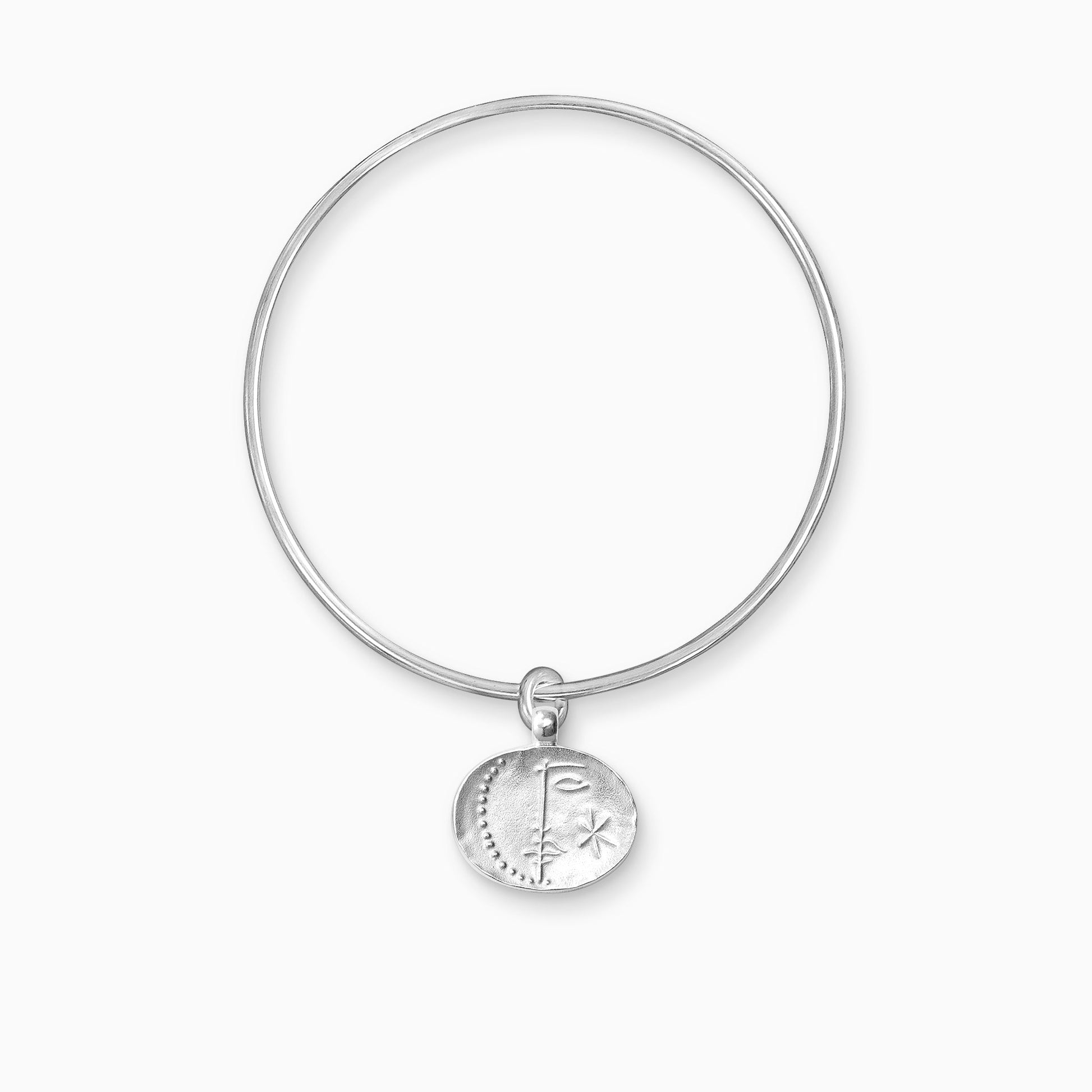 A recycled Silver oval shaped charm with raised image of a Sun on one side and a Moon on the other, freely moving on a round wire bangle.  Charm 16mm x 20mm. Bangle 63mm inside diameter x 2mm round wire.