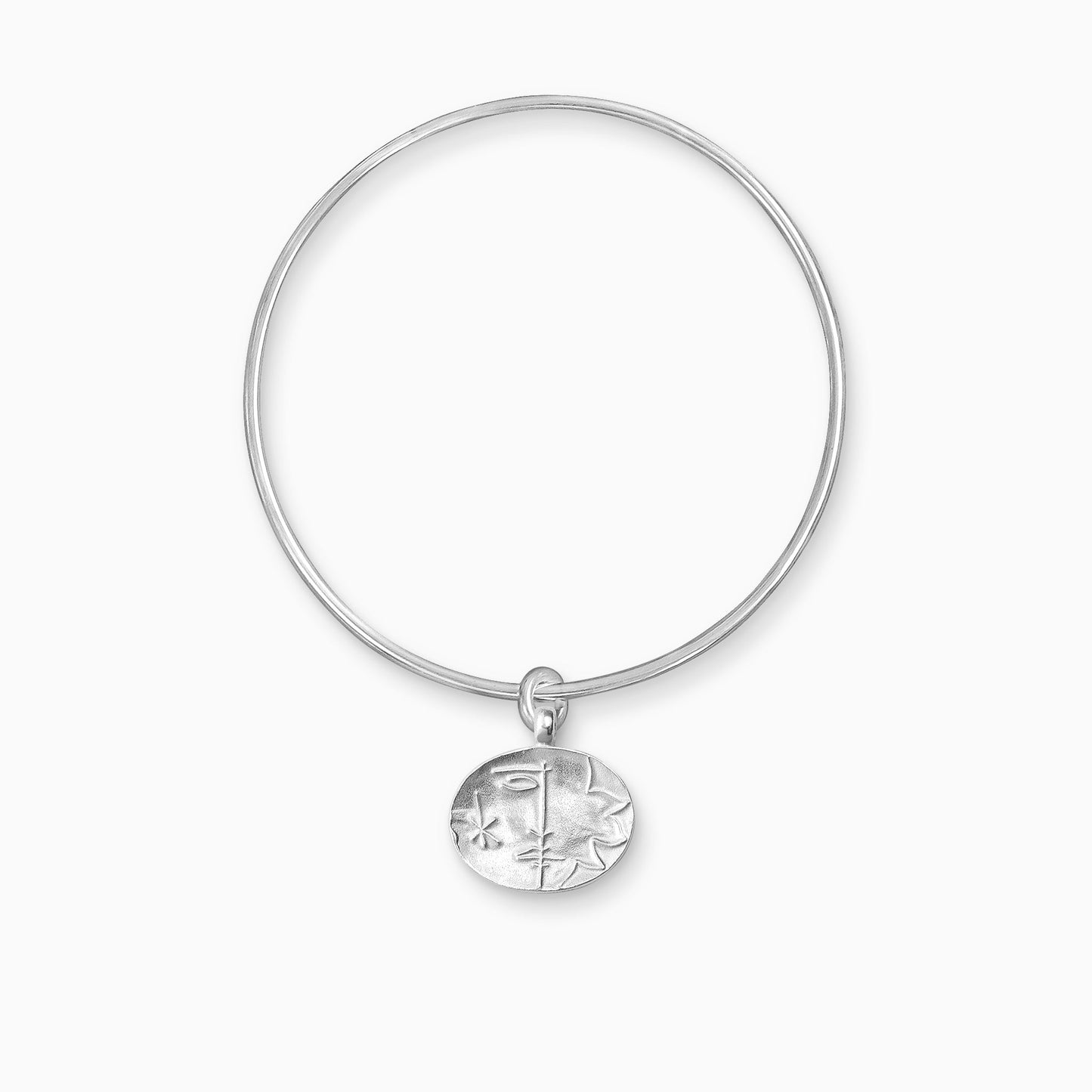 A recycled Silver oval shaped charm with raised image of a Sun on one side and a Moon on the other, freely moving on a round wire bangle.  Charm 16mm x 20mm. Bangle 63mm inside diameter x 2mm round wire.