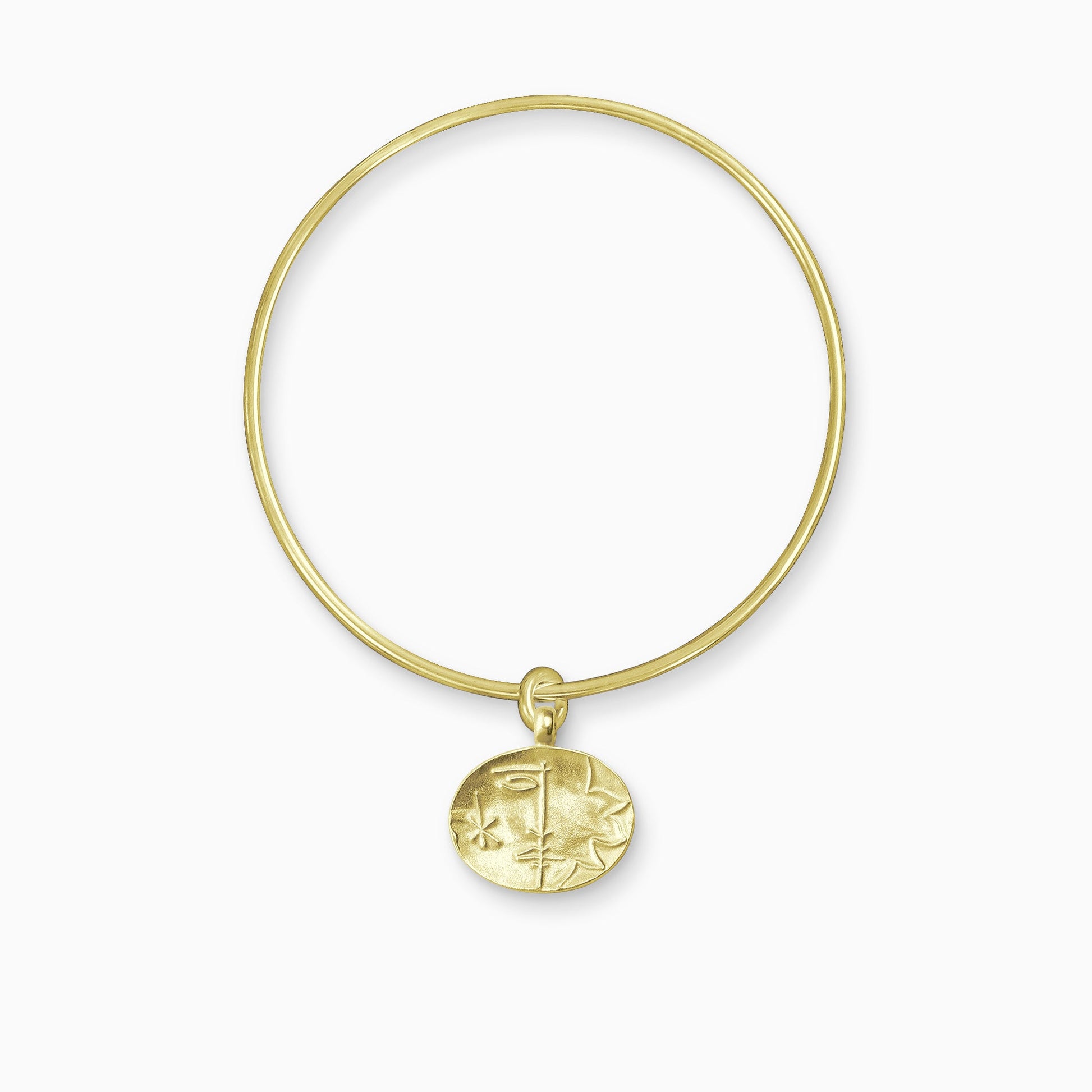 An 18ct Fairtrade yellow gold oval shaped charm with raised image of a Sun on one side and a Moon on the other, freely moving on a round wire bangle.  Charm 16mm x 20mm. Bangle 63mm inside diameter x 2mm round wire.