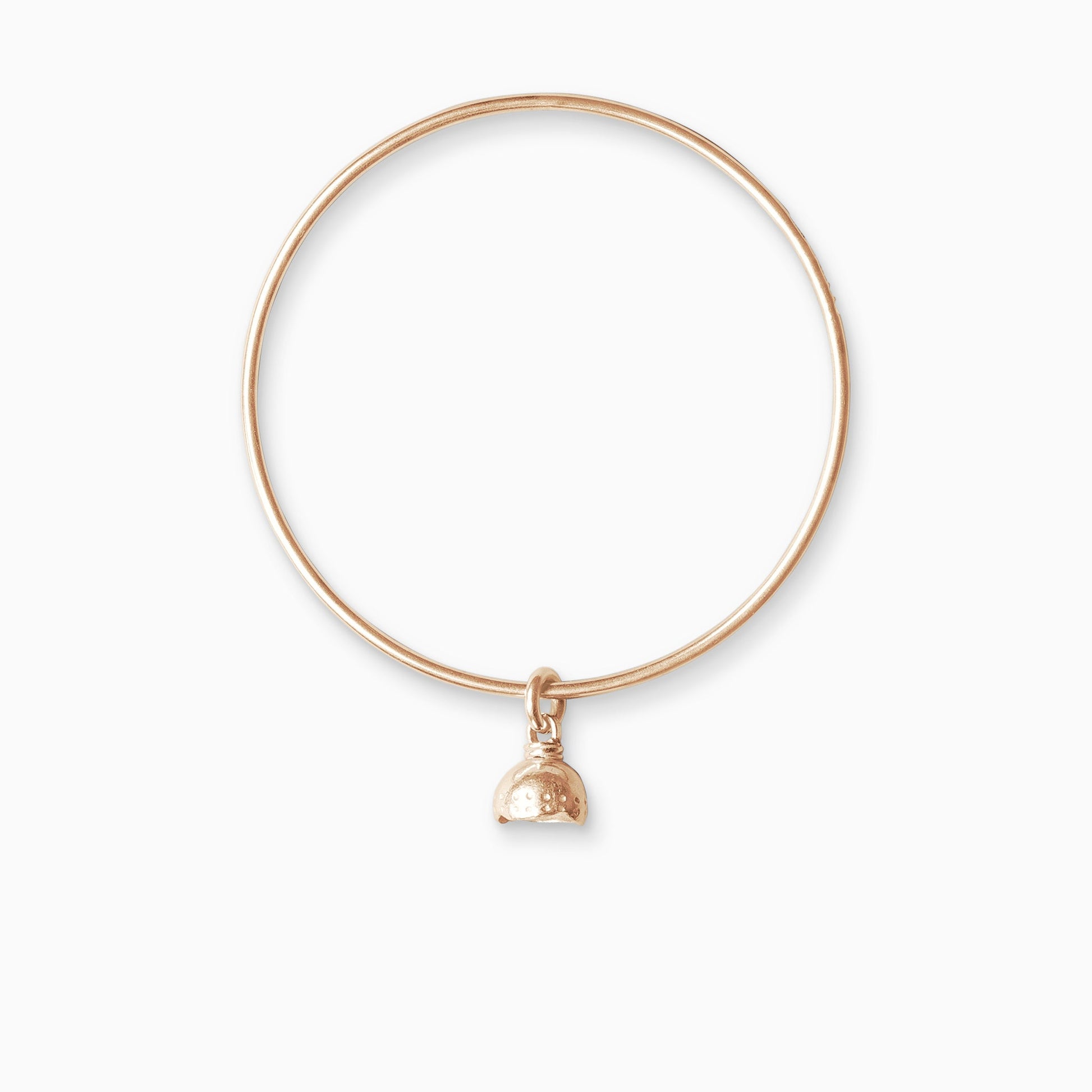 An 18ct Fairtrade rose gold bell shaped charm freely moving on a round wire bangle. Charm 11mm. Bangle 63mm inside diameter x 2mm round wire.