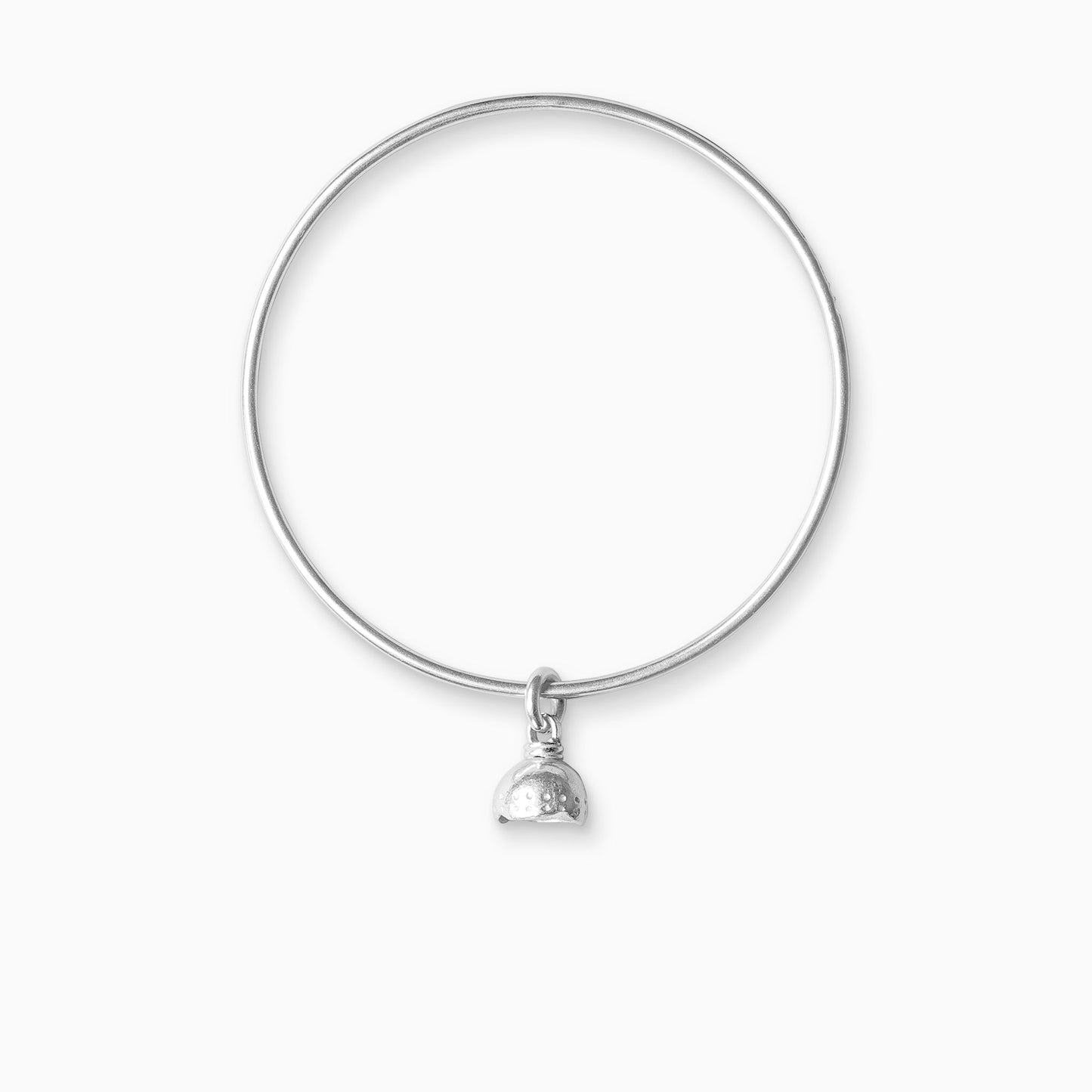 A recycled Silver bell shaped charm freely moving on a round wire bangle. Charm 11mm. Bangle 63mm inside diameter x 2mm round wire.